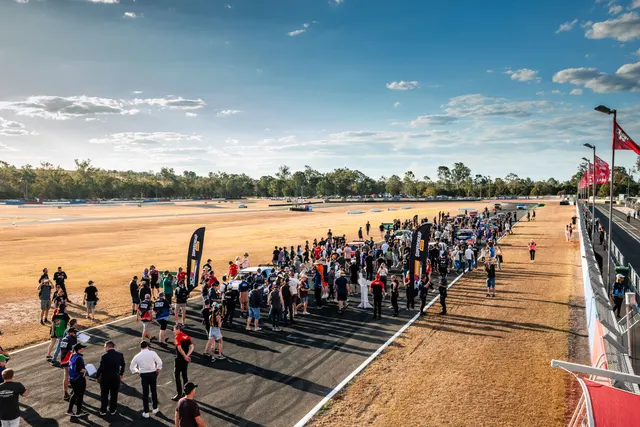 Cars and spectators gathered on the grid at Queensland Raceway